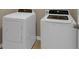 Bright laundry room featuring a white washer and dryer set, offering convenient in-home laundry solutions at 820 Lake Chase, Fairburn, GA 30213