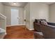 Inviting living room with hardwood floors, neutral walls, and modern furnishings at 820 Lake Chase, Fairburn, GA 30213