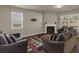Bright living room with a fireplace and large windows at 820 Lake Chase, Fairburn, GA 30213