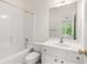 Well-lit bathroom with a tub/shower combination and a vanity at 2301 Waters Edge Trl, Roswell, GA 30075