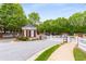 Welcoming entrance to the community with a guard house and picket fences at 2301 Waters Edge Trl, Roswell, GA 30075