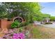 Charming neighborhood entrance with flowers and a brick sign at 2301 Waters Edge Trl, Roswell, GA 30075