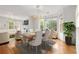 Elegant dining area with chandelier and bay window with views of backyard at 2301 Waters Edge Trl, Roswell, GA 30075