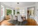 Dining room with large windows, chandelier, and stylish furniture at 2301 Waters Edge Trl, Roswell, GA 30075