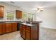 Kitchen includes stainless steel appliances, wooden cabinets, eat-in table, and natural light at 2301 Waters Edge Trl, Roswell, GA 30075
