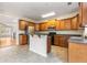 Well-equipped kitchen with wood cabinets, modern appliances, and eat-in bar area at 2301 Waters Edge Trl, Roswell, GA 30075