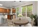 Kitchen with stainless steel appliances and an eat-in dining area with ample natural light at 2301 Waters Edge Trl, Roswell, GA 30075