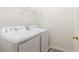Functional laundry room with a side-by-side washer and dryer at 2301 Waters Edge Trl, Roswell, GA 30075