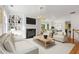 Bright living room with built-in shelves and fireplace, perfect for relaxing and entertaining at 2301 Waters Edge Trl, Roswell, GA 30075