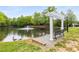Beautiful pond view complete with fountain, geese, park bench, and pergola at 2301 Waters Edge Trl, Roswell, GA 30075