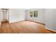 This bedroom has hardwood floors, neutral paint and a double-paned window at 3007 Stratford Arms Dr, Chamblee, GA 30341
