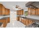 Updated kitchen featuring custom wood cabinets, granite countertops, stainless steel appliances and white tile floors at 3007 Stratford Arms Dr, Chamblee, GA 30341