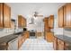Bright kitchen with stainless steel appliances, granite countertops, and white tile flooring at 3007 Stratford Arms Dr, Chamblee, GA 30341