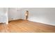 Spacious living room featuring hardwood floors, neutral walls, chandelier, and an open doorway to another room at 3007 Stratford Arms Dr, Chamblee, GA 30341