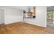 Open living area with hardwood floors and access to the kitchen at 3007 Stratford Arms Dr, Chamblee, GA 30341