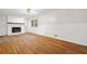 Inviting living area with hardwood floors, a brick fireplace, and wainscoting at 3007 Stratford Arms Dr, Chamblee, GA 30341
