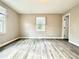 Bright and airy bedroom showcasing gray vinyl flooring and neutral paint, creating a serene retreat at 326 Old Farm Road, Woodstock, GA 30188