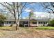 Charming one-story home with gray siding, a covered porch, and a well-maintained front yard at 326 Old Farm Road, Woodstock, GA 30188
