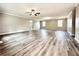 Spacious living room featuring modern gray vinyl floors, neutral walls, and ample natural light at 326 Old Farm Road, Woodstock, GA 30188