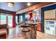 Basement bar with a stone facade, wooden beam, bar seating, and a game room nearby at 3493 Wood Acres Blvd, Duluth, GA 30096
