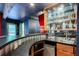 Finished basement bar with a mini-fridge and bar sink, perfect for entertaining at 3493 Wood Acres Blvd, Duluth, GA 30096