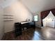 Cozy bedroom featuring vaulted ceilings, wood floors, and lots of built-in storage at 3493 Wood Acres Blvd, Duluth, GA 30096