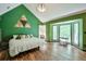 Spacious bedroom with a large window and a vaulted ceiling at 3493 Wood Acres Blvd, Duluth, GA 30096