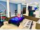 Fun basement bedroom with a gaming theme and a playful piano rug, perfect for a or teenager at 3493 Wood Acres Blvd, Duluth, GA 30096