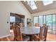Dining area featuring skylights and backyard views at 3493 Wood Acres Blvd, Duluth, GA 30096