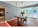 Dining room featuring hardwood floors and large windows for plenty of natural light at 3493 Wood Acres Blvd, Duluth, GA 30096
