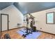 Home exercise room with weight machine and wood look flooring at 3493 Wood Acres Blvd, Duluth, GA 30096