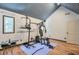 Well-lit exercise room with workout equipment and laminate wood floors at 3493 Wood Acres Blvd, Duluth, GA 30096