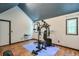 Well-equipped exercise room with a full weight machine, perfect for staying active at home, complete with wood floors at 3493 Wood Acres Blvd, Duluth, GA 30096