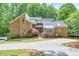 Beautiful brick home featuring a well manicured lawn and concrete driveway at 3493 Wood Acres Blvd, Duluth, GA 30096