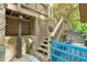 Outdoor shower and stairs leading to an elevated deck, blending nature with convenience at 3493 Wood Acres Blvd, Duluth, GA 30096