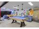 Finished basement game room with a pool table, foosball table, and custom mural art at 3493 Wood Acres Blvd, Duluth, GA 30096