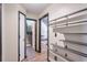 Hallway with modern wall shelves, access to carpeted stairs, and views into multiple rooms at 3493 Wood Acres Blvd, Duluth, GA 30096