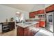 Open kitchen boasts a large island with granite countertops and stainless steel appliances at 3493 Wood Acres Blvd, Duluth, GA 30096