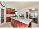 Kitchen offers a center island with granite counters and ample cabinet storage at 3493 Wood Acres Blvd, Duluth, GA 30096