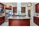Spacious kitchen with granite countertops, cherry cabinets, and stainless steel appliances at 3493 Wood Acres Blvd, Duluth, GA 30096