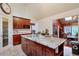 Spacious kitchen featuring dark cabinetry, granite countertops and tile floors at 3493 Wood Acres Blvd, Duluth, GA 30096