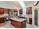 Well-lit kitchen featuring a granite-topped island, stainless appliances, and ample cabinet space at 3493 Wood Acres Blvd, Duluth, GA 30096