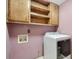 Functional laundry room with a washer and dryer, along with built-in cabinets for storage, adding convenience at 3493 Wood Acres Blvd, Duluth, GA 30096