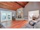 Comfortable living room with stone fireplace, hardwood floors, and easy access to the sunroom at 3493 Wood Acres Blvd, Duluth, GA 30096