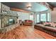 Spacious living room with stone fireplace, hardwood floors, and windows offering plenty of natural light at 3493 Wood Acres Blvd, Duluth, GA 30096