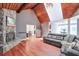 Open living area with stone fireplace, vaulted ceilings, and hardwood floors at 3493 Wood Acres Blvd, Duluth, GA 30096