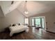 Bright main bedroom featuring vaulted ceilings, and large windows with views of the surrounding area at 3493 Wood Acres Blvd, Duluth, GA 30096