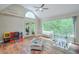Bright playroom with large windows overlooking the greenery, creating a cheerful and inspiring atmosphere at 3493 Wood Acres Blvd, Duluth, GA 30096
