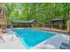 Inviting pool area with cabana, gazebo, and lush greenery, perfect for outdoor enjoyment at 3493 Wood Acres Blvd, Duluth, GA 30096