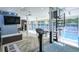 Bright recreation room offers seamless access to the pool and includes a spiral staircase at 3493 Wood Acres Blvd, Duluth, GA 30096